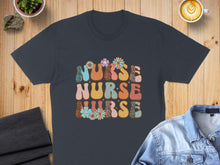 Load image into Gallery viewer, Dark t-shirt with "Nurse Nurse Nurse" text in colorful, retro floral and leopard print.
