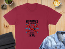 Load image into Gallery viewer, Maroon t-shirt with "No Kings in America Since 1776" and crossed crowns graphic.
