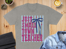 Load image into Gallery viewer, Grey t-shirt with "Just a Small Town Teacher" text and blue bow.

