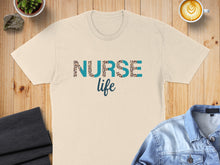 Load image into Gallery viewer, Cream t-shirt with "Nurse Life" text in leopard print and blue letters.
