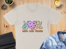 Load image into Gallery viewer, Peace Love Nursing graphic on a cream t-shirt with stethoscope and heart.

