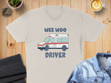 Load image into Gallery viewer, Cream t-shirt with cartoon ambulance graphic and "WEE WOO DRIVER" text.

