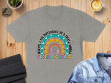 Load image into Gallery viewer, Grey t-shirt with colorful text "MAKING A BIG DIFFERENCE IN A SMALL WORLD PEDIATRIC NURSE"

