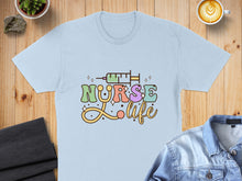 Load image into Gallery viewer, Light blue t-shirt with "Nurse Life" text and a syringe design.
