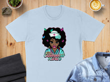 Load image into Gallery viewer, Light blue t-shirt featuring a cartoon nurse with butterflies and the text "Blessed Nurse".

