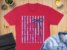 Load image into Gallery viewer, Red t-shirt with blue stripes and pink text "Just a girl who loves teaching" and blue bow.
