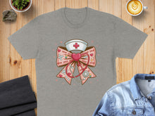 Load image into Gallery viewer, Nurse bow with stethoscope, heart, and XOXO pattern on grey t-shirt.
