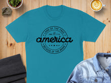 Load image into Gallery viewer, Blue t-shirt with "Land of the Free, Since 1776, Because of the Brave" text.
