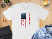 Load image into Gallery viewer, White t-shirt with a distressed American flag graphic featuring firearms.
