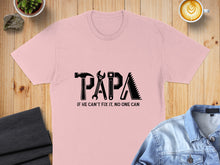 Load image into Gallery viewer, Pink t-shirt with black tools forming "PAPA" and text "IF HE CAN'T FIX IT, NO ONE CAN".
