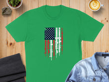 Load image into Gallery viewer, Green t-shirt with distressed American flag design featuring firearms.
