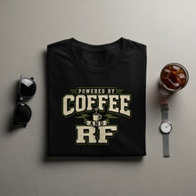 Load image into Gallery viewer, Black t-shirt with "Powered by Coffee and RF" graphic, sunglasses, and iced coffee.
