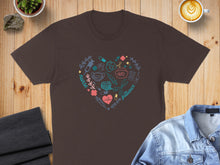Load image into Gallery viewer, Brown t-shirt with a heart-shaped medical design including stethoscope, syringe, and pill bottle.
