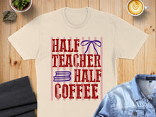 Load image into Gallery viewer, T-shirt with "HALF TEACHER HALF COFFEE" text and blue bow graphic.
