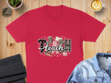 Load image into Gallery viewer, Red t-shirt with "Teach" graphic featuring school supplies and patterns.
