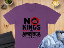 Load image into Gallery viewer, Purple t-shirt with "NO KINGS IN AMERICA" text and crown crossed out.
