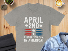 Load image into Gallery viewer, Gray t-shirt with "April 2nd Liberation Day in America!" text and flag design.
