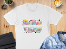 Load image into Gallery viewer, White t-shirt with colorful pencils and bows design split in the middle.
