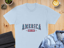 Load image into Gallery viewer, Light blue t-shirt with "AMERICA EST. 1776" text in a distressed star pattern.
