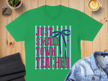 Load image into Gallery viewer, Green t-shirt with "Just a small town teacher" text and blue bow design.
