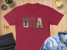 Load image into Gallery viewer, Burgundy t-shirt with "USA EST. 1776" text and American flag graphic.
