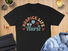 Load image into Gallery viewer, Black t-shirt with "Hospice Life Nurse" text and medical icons.
