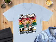 Load image into Gallery viewer, Juneteenth celebration t-shirt with text "Celebrating Black Freedom."
