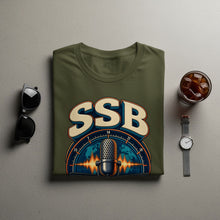 Load image into Gallery viewer, Green t-shirt with "SSB" and vintage microphone graphic on a world map.
