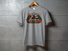 Load image into Gallery viewer, Grey t-shirt with "Licensed to Transmit" graphic featuring radio equipment and mountains.
