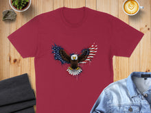 Load image into Gallery viewer, Maroon t-shirt with an eagle spread wings graphic, American flag colors.
