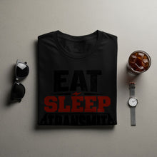 Load image into Gallery viewer, Black t-shirt with "EAT SLEEP TRANSMIT" text, sunglasses, and iced drink.
