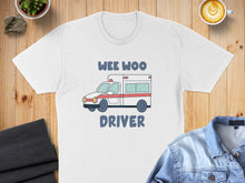 Load image into Gallery viewer, White t-shirt with a cartoon ambulance and "WEE WOO DRIVER" text.
