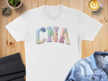 Load image into Gallery viewer, White t-shirt with colorful patchwork "CNA" lettering.
