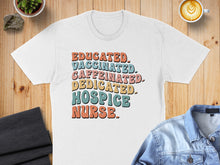 Load image into Gallery viewer, T-shirt with "Educated. Caffeinated. Dedicated. Hospice Nurse." text in colorful retro font.
