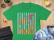 Load image into Gallery viewer, Green t-shirt with "The Life of a Teacher" text and ribbon design.
