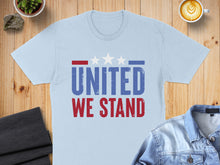 Load image into Gallery viewer, Light blue t-shirt with "UNITED WE STAND" in red and blue lettering.
