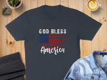 Load image into Gallery viewer, Dark t-shirt with American flag and "GOD BLESS America" text.
