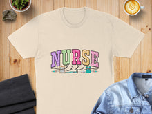 Load image into Gallery viewer, Cream t-shirt with "NURSE LIFE" text and medical icons.
