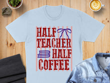 Load image into Gallery viewer, Light blue t-shirt with "HALF TEACHER HALF COFFEE" text and striped background.
