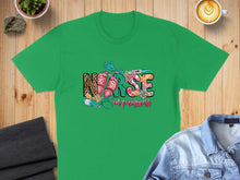 Load image into Gallery viewer, Green t-shirt with "Nurse in progress" text, stethoscope, and medical items.
