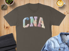 Load image into Gallery viewer, Brown t-shirt with "CNA" in colorful patchwork letters.
