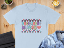 Load image into Gallery viewer, Light blue t-shirt with "Registered Nurse" text and a heart.
