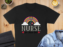 Load image into Gallery viewer, Black t-shirt with rainbow, stethoscope, and "Nurse Love Inspire Heal" text.
