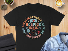 Load image into Gallery viewer, Black t-shirt with "Hospice Nurse Life" circular graphic and medical icons.
