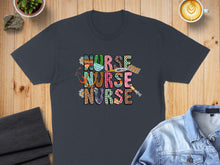 Load image into Gallery viewer, Dark t-shirt with "Nurse Nurse" text and medical icons.
