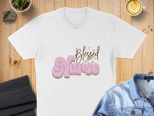 Load image into Gallery viewer, White t-shirt with "Blessed Nurse" text in pink and gold wavy font.
