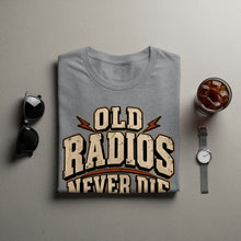 Load image into Gallery viewer, Grey t-shirt with "OLD RADIOS NEVER DIE" text, sunglasses, and iced drink.
