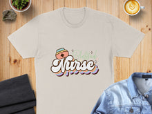 Load image into Gallery viewer, Cream t-shirt with "Blessed Nurse" text and colorful striped accents.
