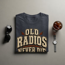 Load image into Gallery viewer, Dark gray t-shirt with "OLD RADIOS NEVER DIE" text and vintage graphic.
