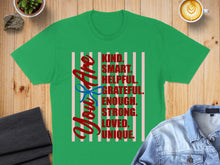 Load image into Gallery viewer, Green t-shirt with "You Are KIND. SMART. HELPFUL. GRATEFUL. ENOUGH. STRONG. LOVED. UNIQUE." text.
